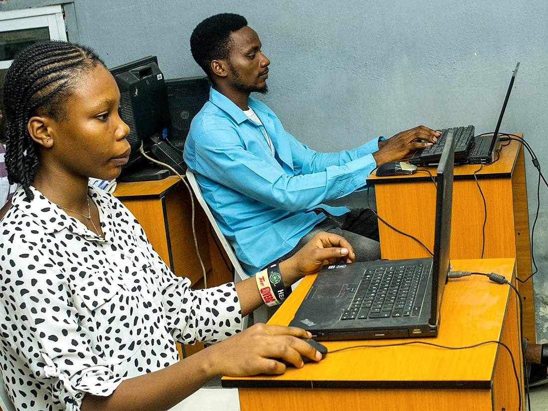 An instructor teaching a student at GeoTech Academy